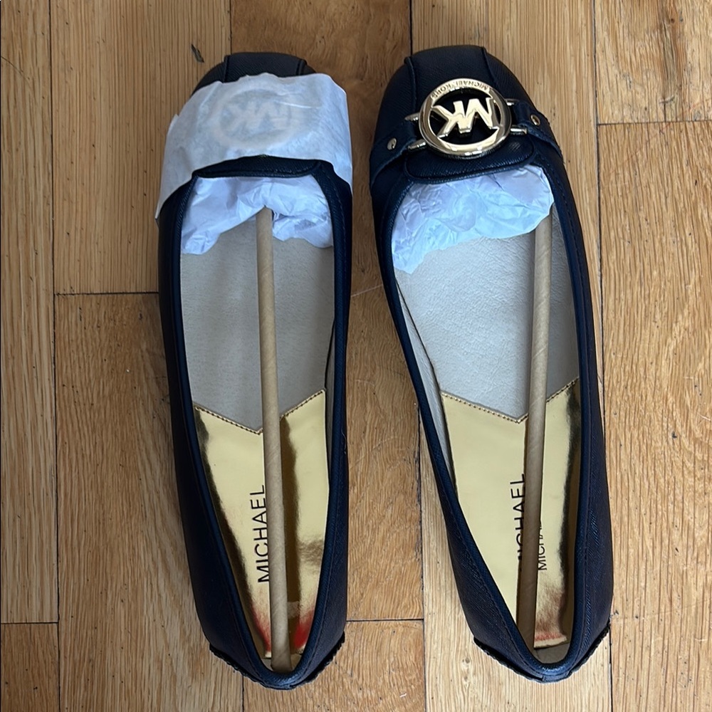 Michael Kors navy Loafers with Gold Emblem